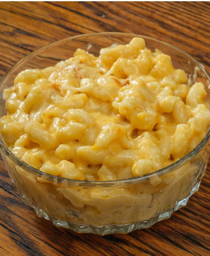 Creamy mac and cheese in a glass bowl